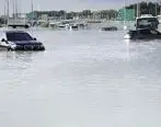 (ویدئو) گریه زاری دختر ایرانی از سیل دبی | سیل ماشین اش را به زیر آب برد
